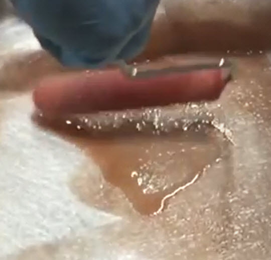 wetting out fibreglass with a roller